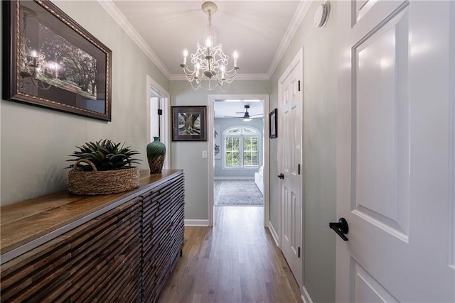 1021 Wetherby Way, Johns Creek, GA 30022 - hall with a chandelier, dark wood-style flooring, ornamental molding, and baseboards