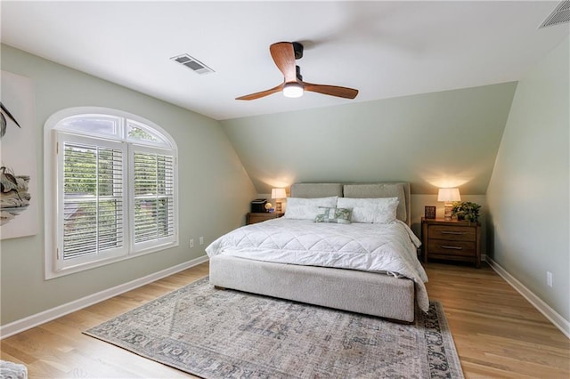 1021 Wetherby Way, Johns Creek, GA 30022 - bedroom featuring light wood-style floors, vaulted ceiling, baseboards, and ceiling fan