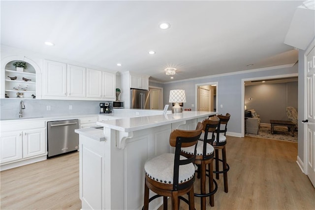 1021 Wetherby Way, Johns Creek, GA 30022 - kitchen featuring stainless steel appliances, a sink, a center island, white cabinets, and recessed lighting