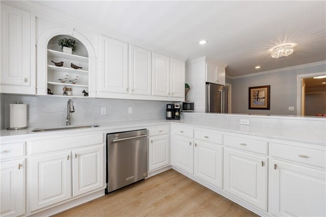 1021 Wetherby Way, Johns Creek, GA 30022 - kitchen with stainless steel appliances, a sink, light countertops, crown molding, and white cabinets