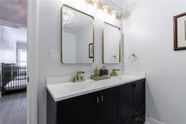 1021 Wetherby Way, Johns Creek, GA 30022 - full bathroom featuring crown molding, double vanity, baseboards, and wood finished floors