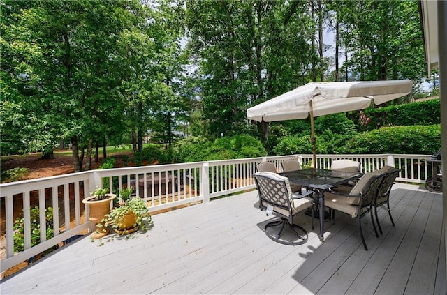 1021 Wetherby Way, Johns Creek, GA 30022 - wooden terrace with outdoor dining area and view of wooded area
