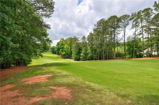 1021 Wetherby Way, Johns Creek, GA 30022 - view of property's community featuring a yard, view of golf course, and view of scattered trees