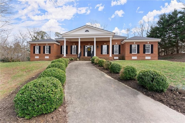 neoclassical / greek revival house with a porch and a front yard