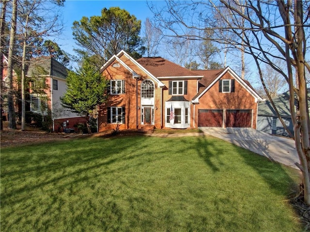 view of front of property with a front yard and a garage