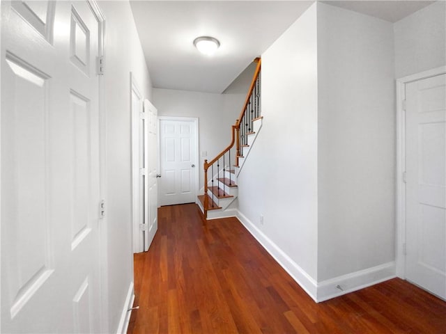 corridor featuring dark hardwood / wood-style floors