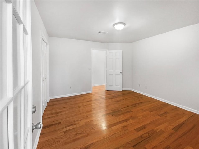 unfurnished bedroom featuring wood-type flooring