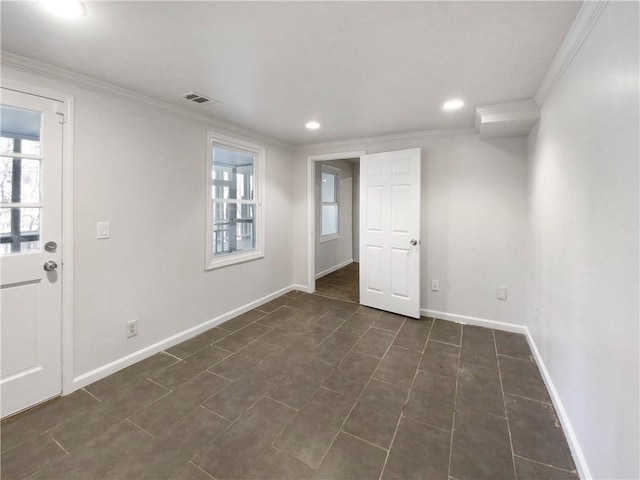 spare room with crown molding