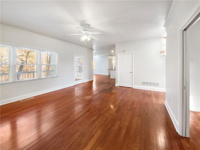 unfurnished living room featuring ceiling fan, dark hardwood / wood-style flooring, and crown molding