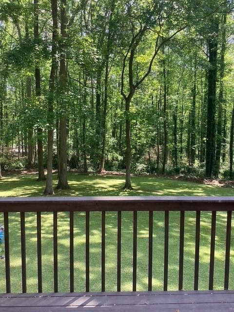 9278 Seminole Rd, Jonesboro, GA 30236 - wooden deck with a lawn