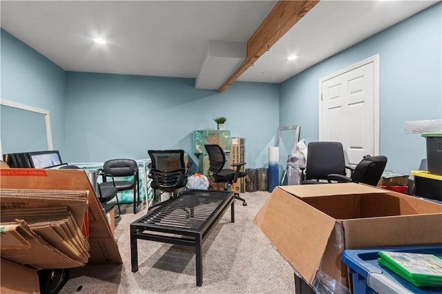 carpeted office space with beamed ceiling