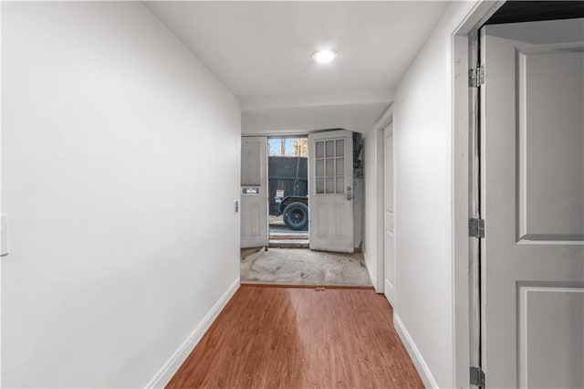 corridor featuring light hardwood / wood-style floors