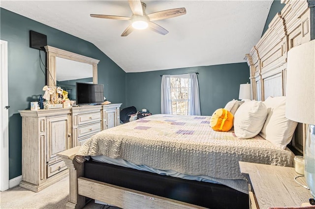 bedroom featuring ceiling fan, light colored carpet, and lofted ceiling