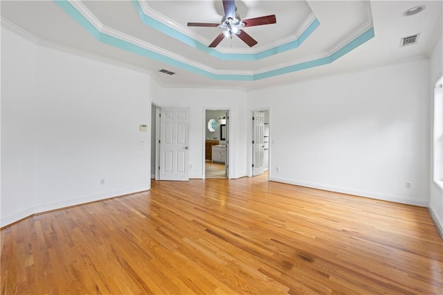 387 Lauren Marie Dr, Braselton, GA 30517 - unfurnished room featuring ceiling fan, a raised ceiling, ornamental molding, light wood-style floors, and baseboards