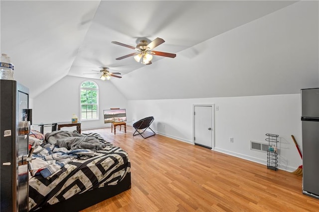 387 Lauren Marie Dr, Braselton, GA 30517 - bedroom featuring lofted ceiling, light wood-style flooring, freestanding refrigerator, baseboards, and ceiling fan