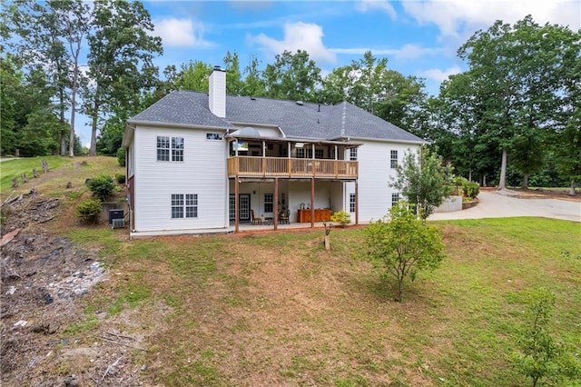 387 Lauren Marie Dr, Braselton, GA 30517 - back of house featuring a yard, a chimney, central AC, a wooden deck, and roof with shingles