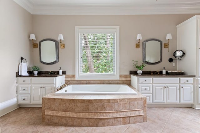 bathroom with two vanities, tile patterned floors, a garden tub, and ornamental molding