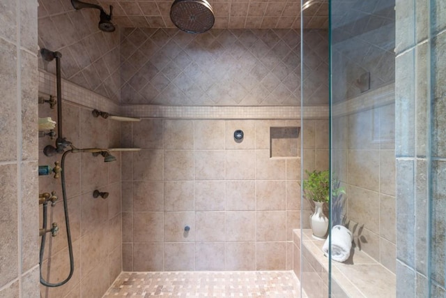 full bathroom with tiled shower