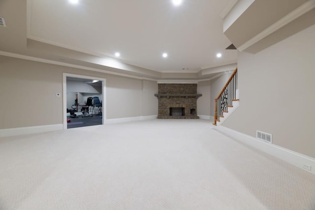 finished basement with visible vents, baseboards, stairs, carpet floors, and recessed lighting