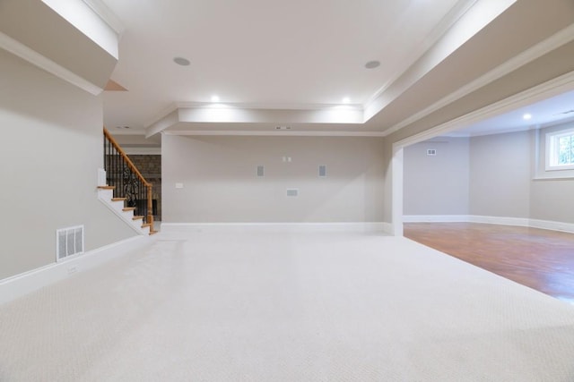 below grade area with visible vents, ornamental molding, recessed lighting, stairway, and baseboards