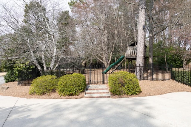 surrounding community with a gate, playground community, and fence