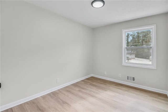 empty room with light wood-type flooring