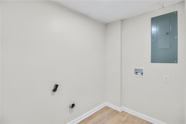 laundry area featuring electric panel, hookup for a washing machine, and hardwood / wood-style floors