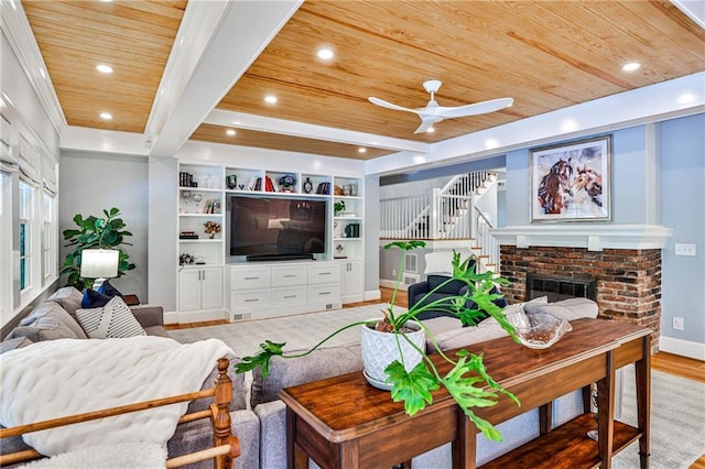 living area with recessed lighting, a ceiling fan, baseboards, wood ceiling, and light wood-style flooring