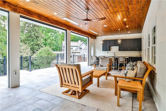 sunroom / solarium featuring a sink