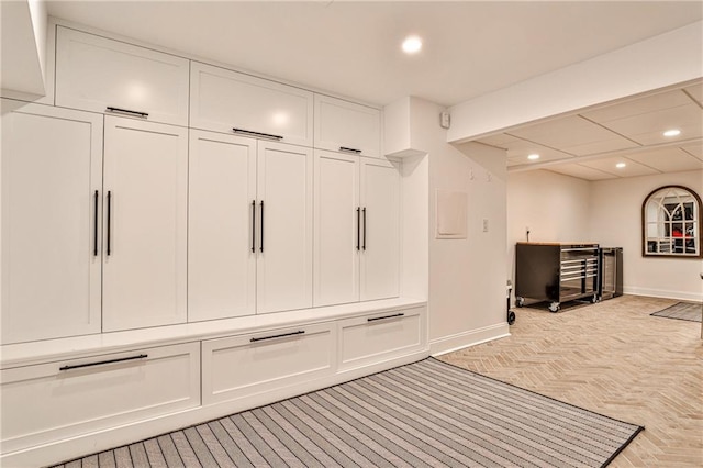 mudroom with baseboards and recessed lighting