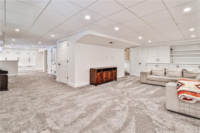living area featuring baseboards, carpet, and recessed lighting