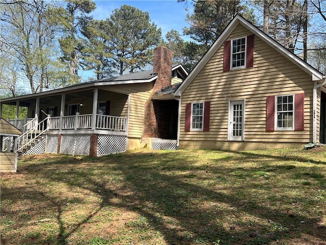5834 Heardsville Rd, Cumming, GA 30028 - view of side of property with covered porch, a yard, and a chimney