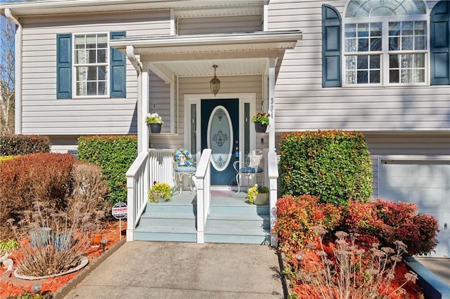 view of exterior entry with a garage