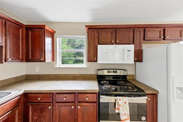 4701 Flat Shoals Rd Unit 37H, Union City, GA 30291 - kitchen featuring white appliances, reddish brown cabinets, and light countertops