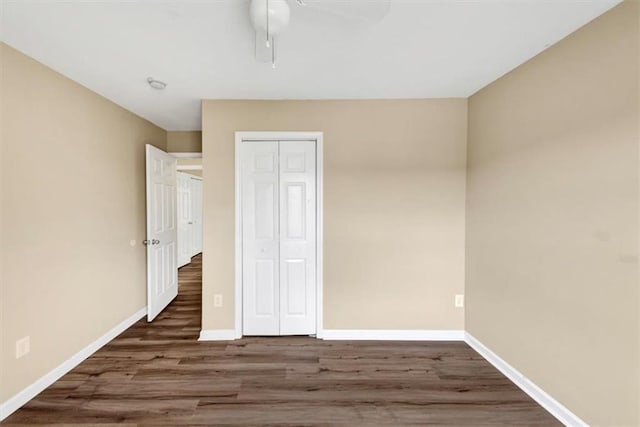 4701 Flat Shoals Rd Unit 37H, Union City, GA 30291 - unfurnished bedroom featuring wood finished floors, baseboards, a closet, and ceiling fan