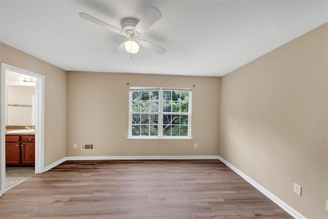 4701 Flat Shoals Rd Unit 37H, Union City, GA 30291 - unfurnished room with light wood-style flooring, a ceiling fan, baseboards, and a sink