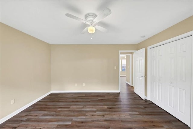 4701 Flat Shoals Rd Unit 37H, Union City, GA 30291 - unfurnished bedroom featuring baseboards, wood finished floors, a closet, and ceiling fan