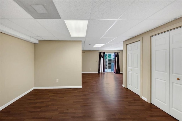 4701 Flat Shoals Rd Unit 37H, Union City, GA 30291 - basement featuring dark wood finished floors, a paneled ceiling, and baseboards