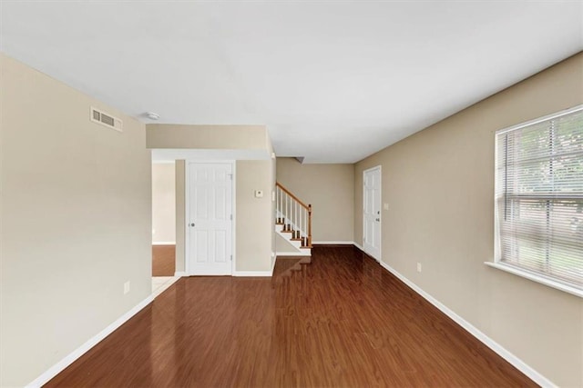 4701 Flat Shoals Rd Unit 37H, Union City, GA 30291 - empty room featuring wood finished floors, stairway, and baseboards