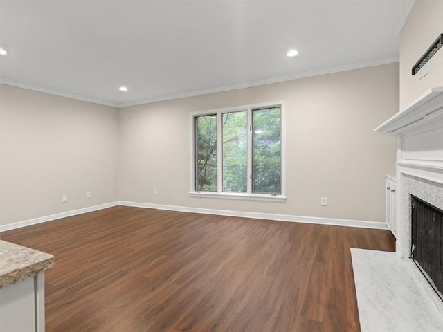 95 Ivy Trl NE, Atlanta, GA 30342 - unfurnished living room featuring dark wood-style flooring, recessed lighting, baseboards, a fireplace, and crown molding