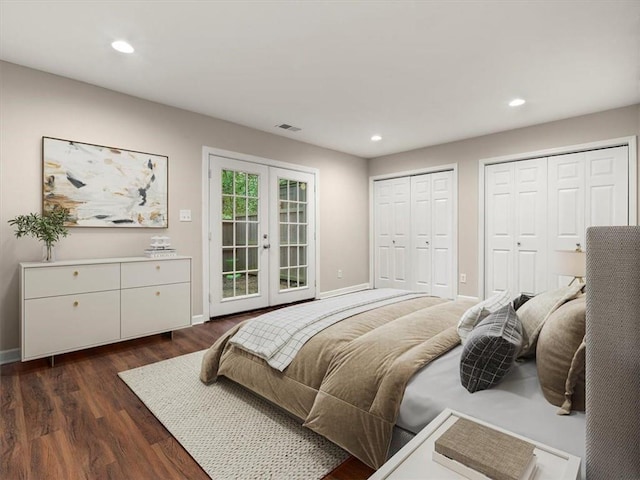 95 Ivy Trl NE, Atlanta, GA 30342 - bedroom with french doors, dark wood-style floors, two closets, baseboards, and recessed lighting