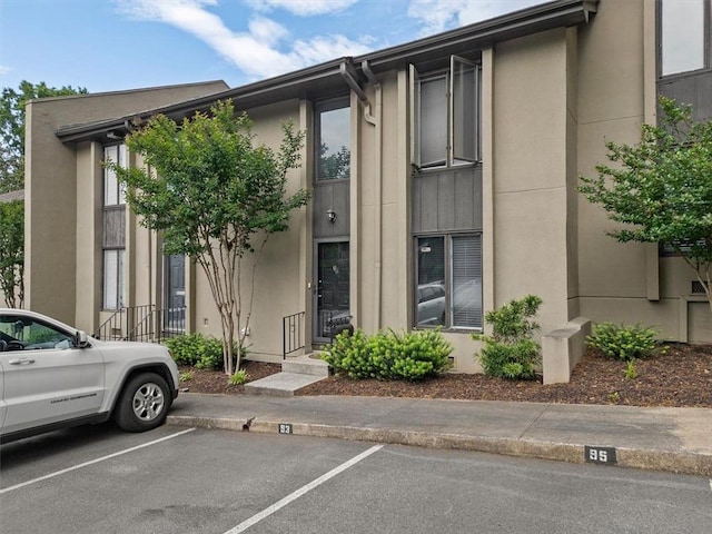 95 Ivy Trl NE, Atlanta, GA 30342 - view of property featuring uncovered parking
