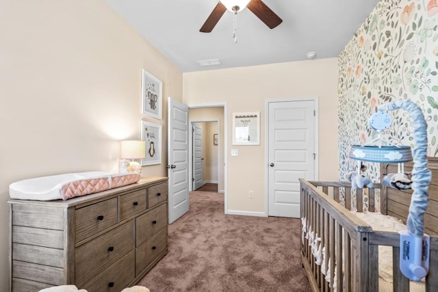 carpeted bedroom featuring baseboards and ceiling fan