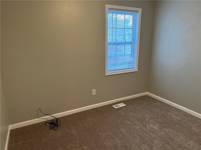 unfurnished room featuring carpet flooring