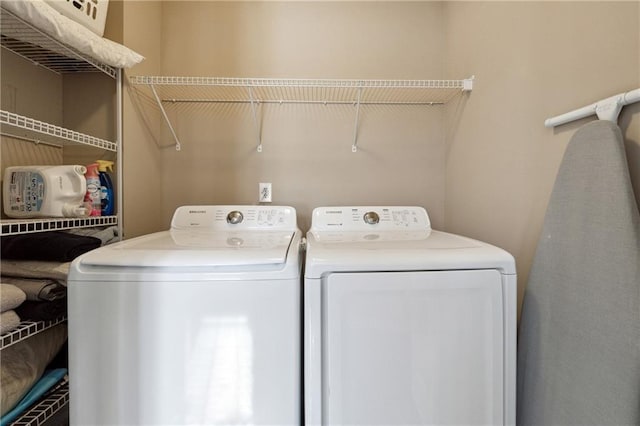 laundry room featuring washer and dryer and laundry area