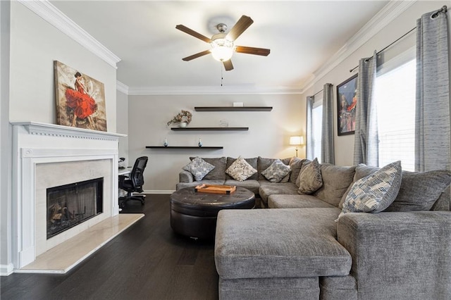 living room with baseboards, ornamental molding, dark wood finished floors, and a high end fireplace