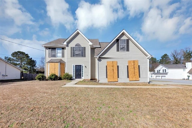 front facade featuring a front lawn