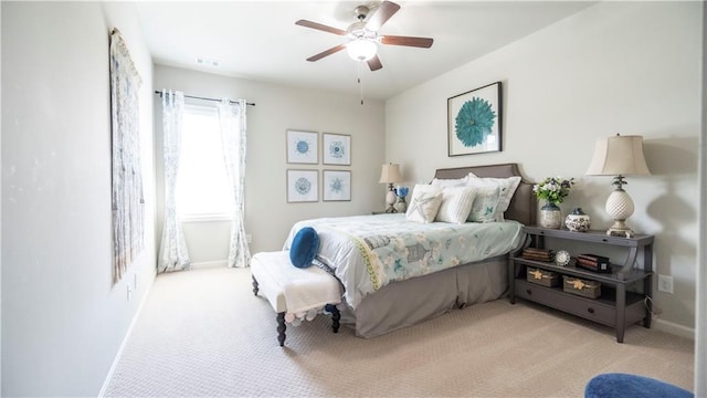 bedroom with carpet flooring, baseboards, a ceiling fan, and visible vents