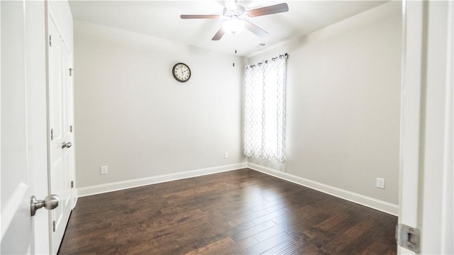 unfurnished room featuring dark wood-style flooring, baseboards, ceiling fan, and visible vents