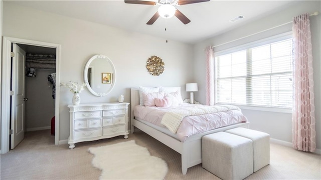 715 Laura Jean Ct, Buford, GA 30518 - bedroom with light carpet, a walk in closet, and baseboards